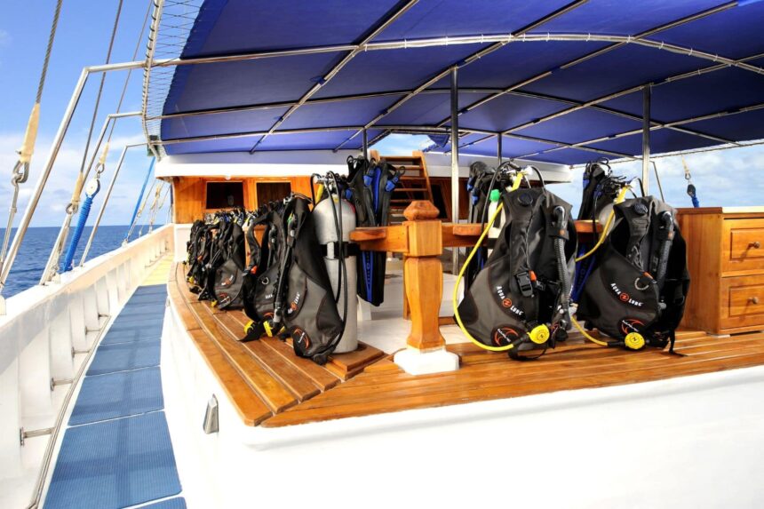 scuba gear set up along the deck of the Palau Siren liveaboard
