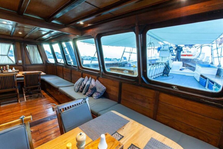 cushioned lounge seating by the windows aboard the Aurora