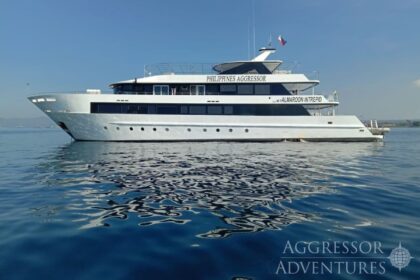 Philippines Aggressor liveaboard dive yacht at anchor on calm blue water
