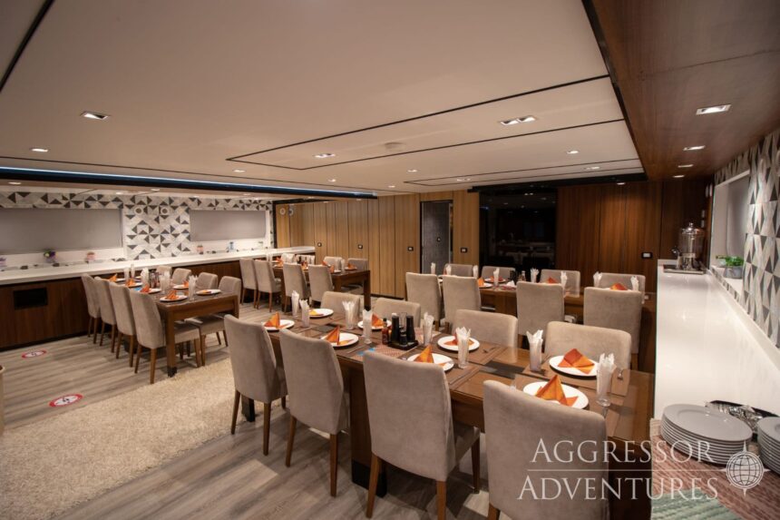 Dining room set with tables and chairs aboard the Red Sea Aggressor IV