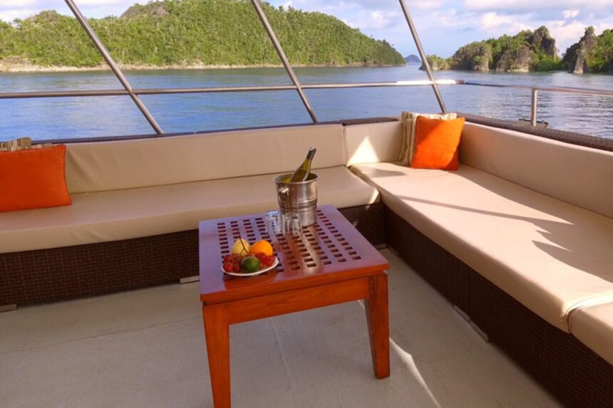 Outdoor lounge seating on the Mermaid II overlooking Raja Ampat islands