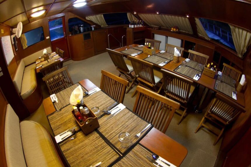 Dining area on the Mermaid II set with tables, chairs and place settings