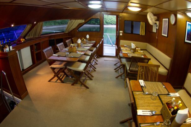 Dining room on the Mermaid II set up for a group meal with multiple tables