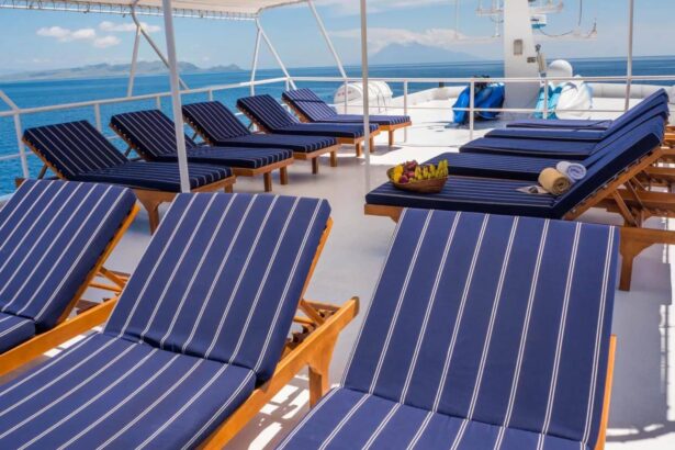 Rows of navy striped sun loungers on the Mermaid I deck facing the ocean