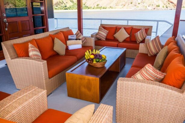 Orange cushioned outdoor sofas on the Mermaid I deck with a fruit bowl on the table