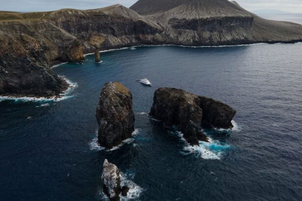 Aerial view of the Nautilus Belle Amie anchored beside Socorro's volcanic rock pinnacles