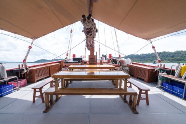 Dining tables and benches set up on The Junk's open deck