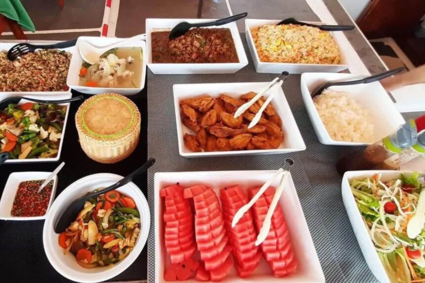 Buffet spread of rice, curry, watermelon and salad aboard The Junk