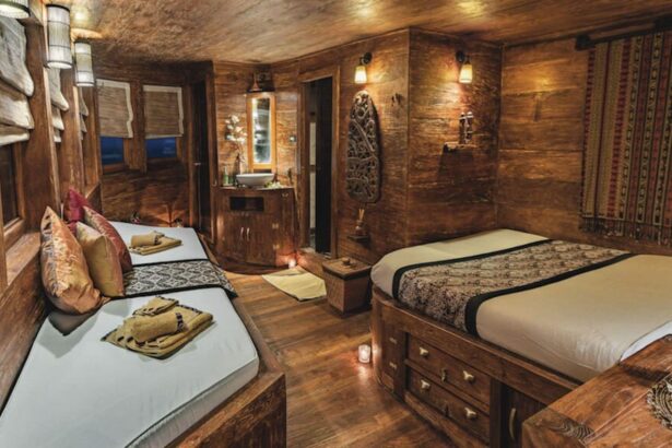 Wood-finished twin cabin aboard the Arenui with carved details