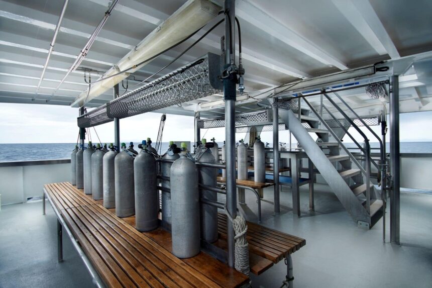 Rows of filled scuba tanks staged on the Pacific Master's dive deck