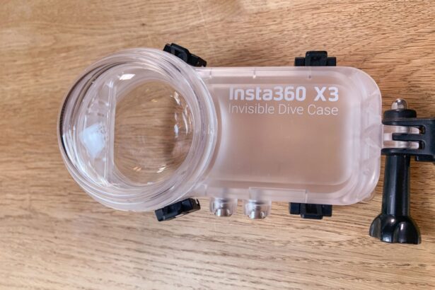 Close up of the empty Insta360 X3 Invisible Dive Case showing its domed lens port and mounting bracket