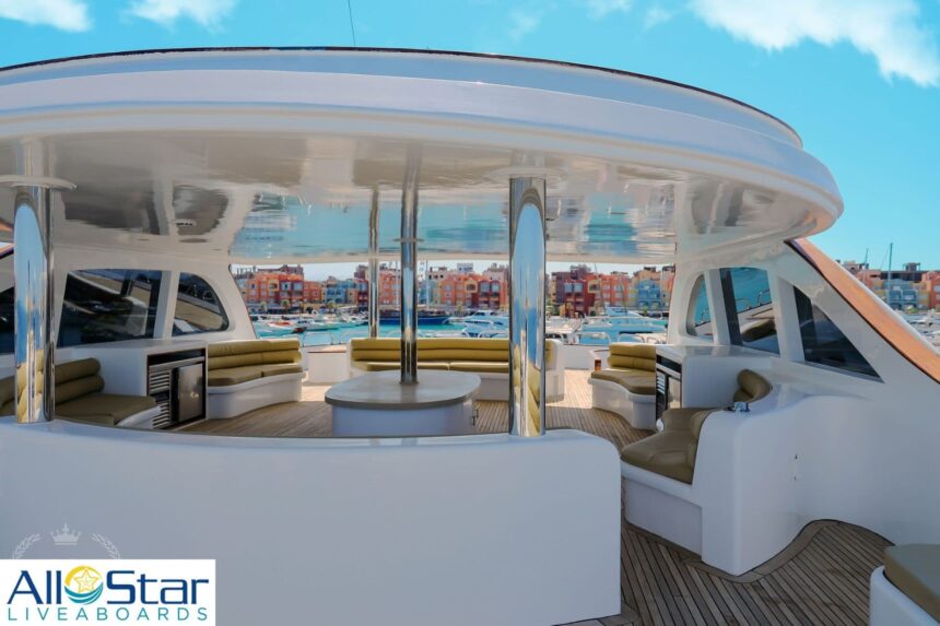 sundeck lounge area with cushioned seating under a shaded canopy