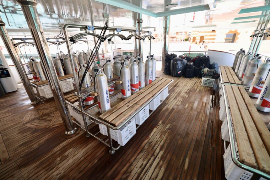 Dive tanks and gear racked on the deck of the All Star Red Sea liveaboard