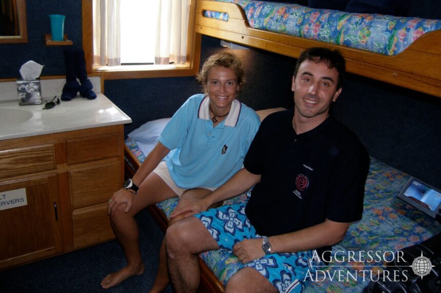 Couple relaxing together in a cabin aboard the Palau Aggressor II