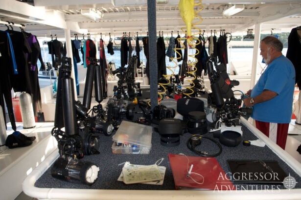 Underwater camera equipment laid out on the dive deck of the Palau Aggressor II