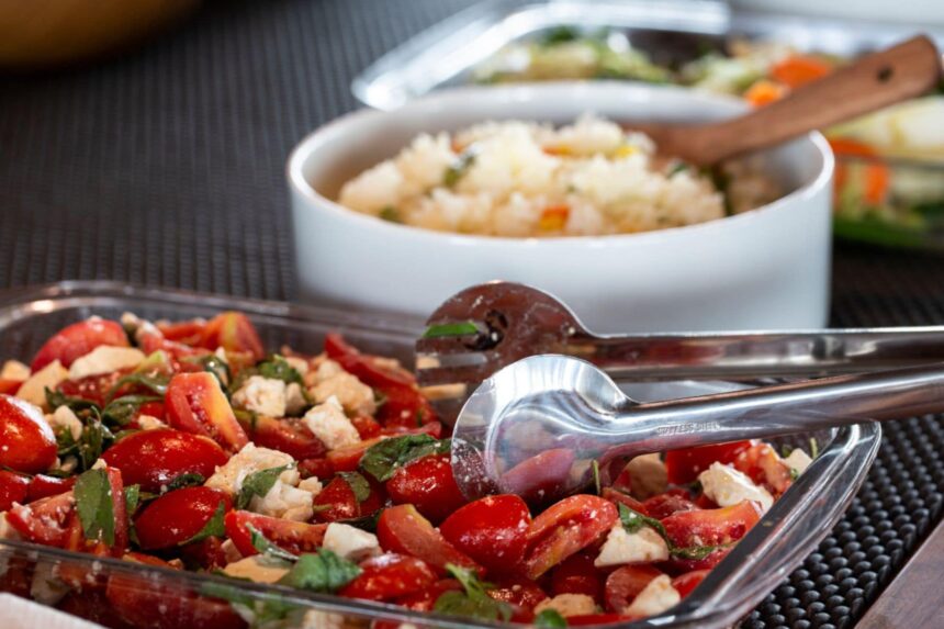 Close-up of tomato salad and rice dishes served aboard the Coralia