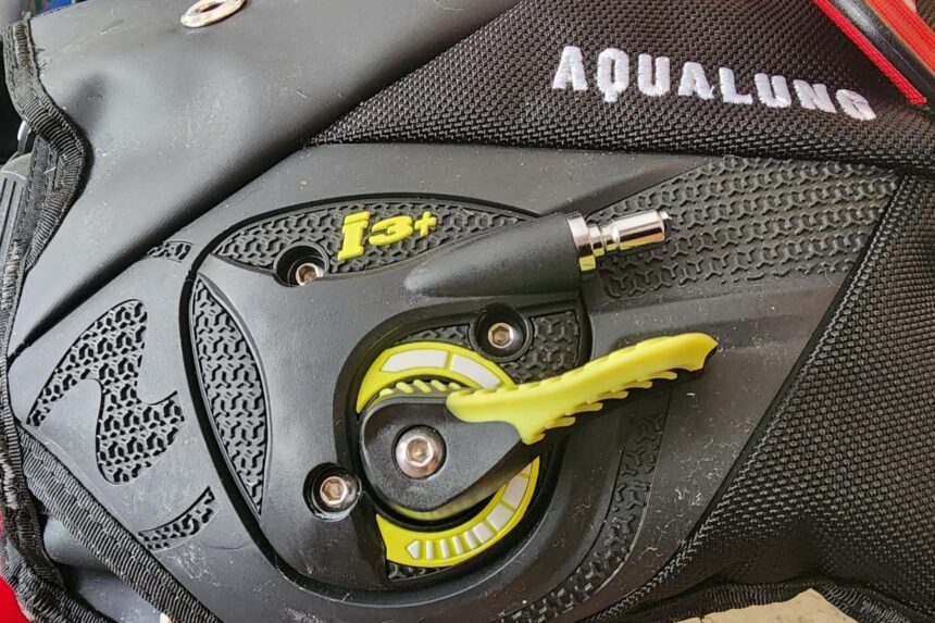 Close-up of the yellow i3+ lever that controls inflation and deflation on the Aqualung Axiom