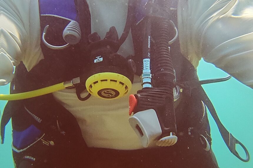 Front view underwater of our tester in the Mares Prestige SLS with inflator and octopus across the chest
