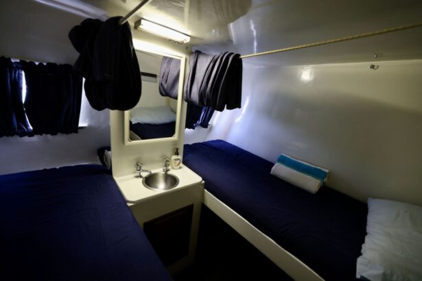 Twin bed cabin aboard the Cat Ppalu with a small sink