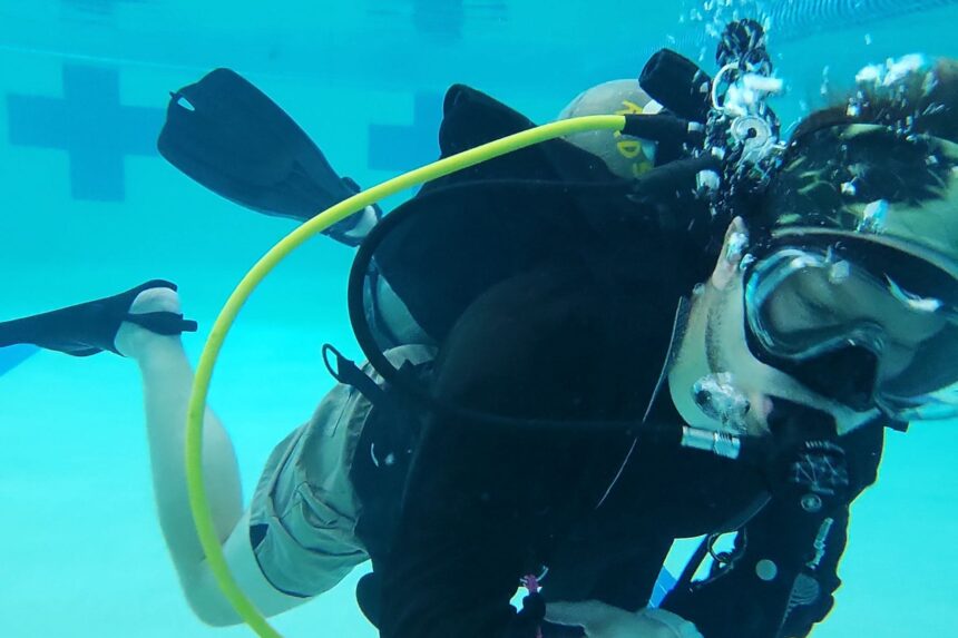 Our tester trimmed out horizontally in a pool while testing the Aqualung Rogue back inflation