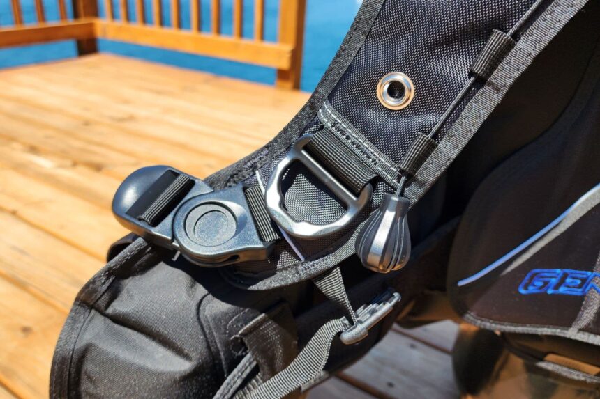 Close-up of a swiveling shoulder D-ring and quick release buckle on the Genesis Origin