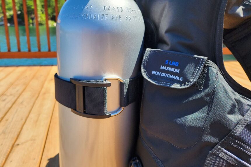 Genesis Origin trim pocket marked 5 lbs maximum non ditchable next to the tank cam band
