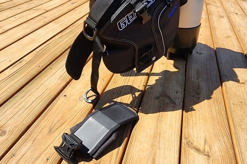 Genesis Origin BCD on a dock with one ditchable weight pocket pulled out on the boards