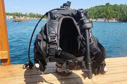 Sherwood Avid Phantom BCD with weight pockets and inflator hose set up on a dock for DIVEIN testing