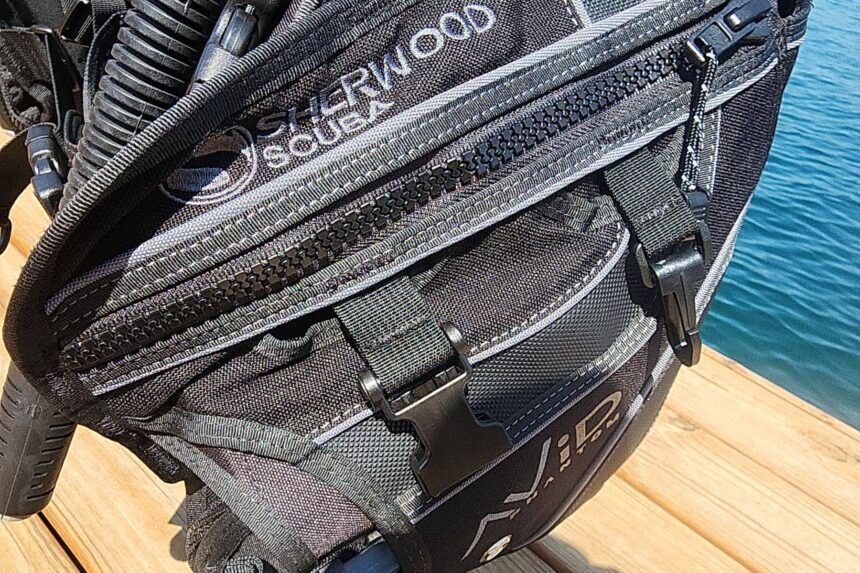 Close-up of the zippered cargo pockets and buckles on the Sherwood Avid Phantom BCD