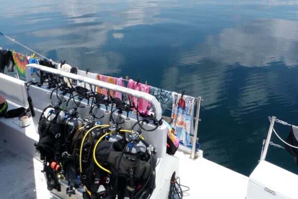 Wetsuits and dive gear drying along the boat's rail