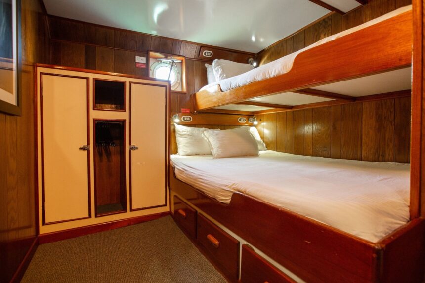 Bunk bed cabin with built-in wardrobe aboard the Nautilus UnderSea