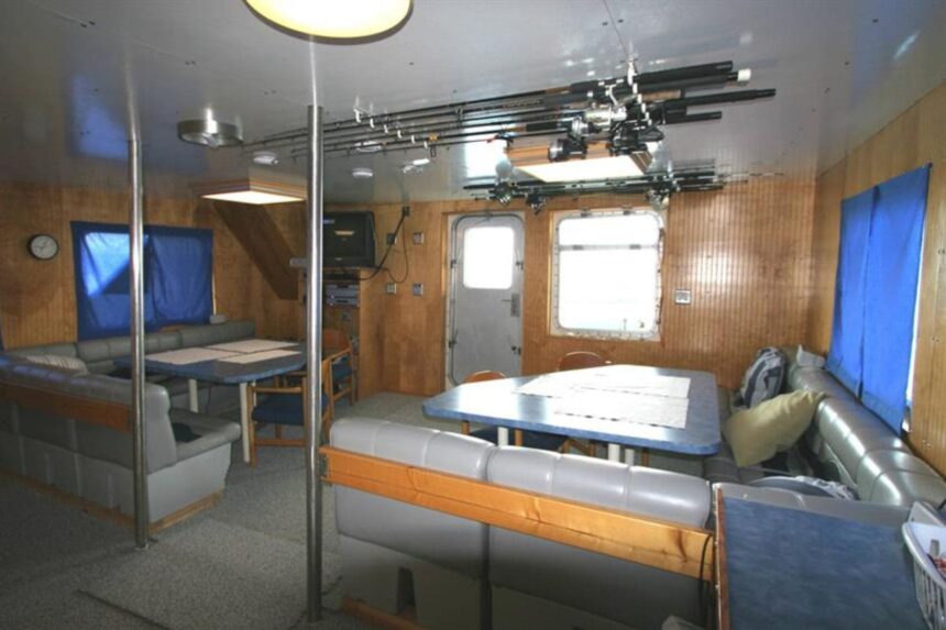 Bunk cabin aboard the Dolphin Dream with colorful fish print bedding