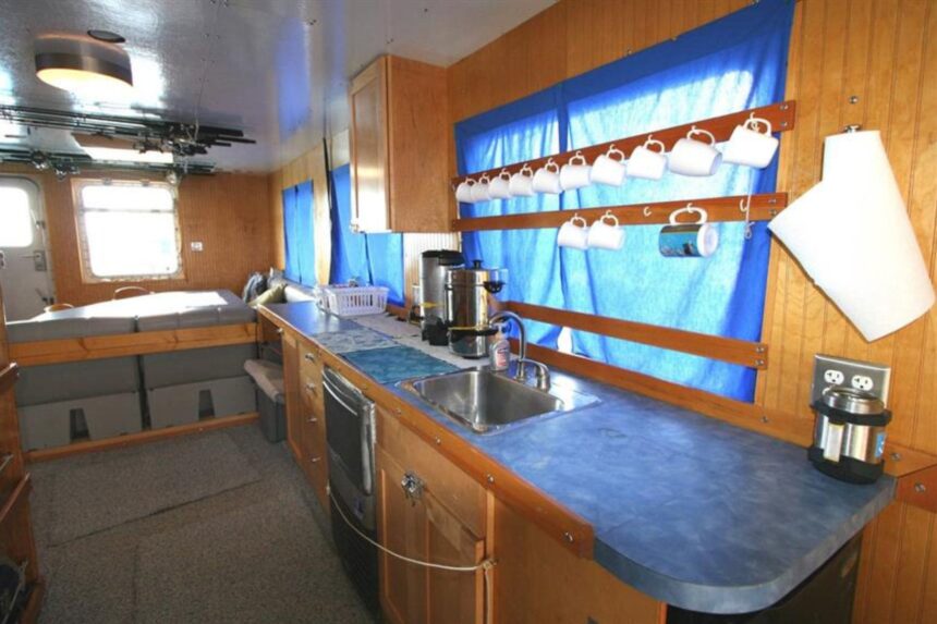 The Dolphin Dream liveaboard viewed from the side at sea