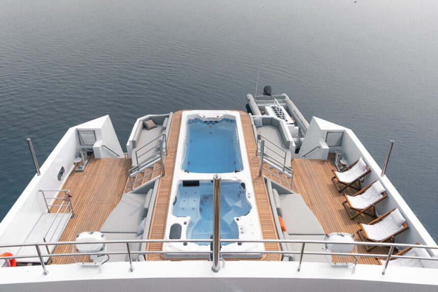 Aerial view of the M/Y White Pearl's aft deck with plunge pool, jacuzzi and loungers