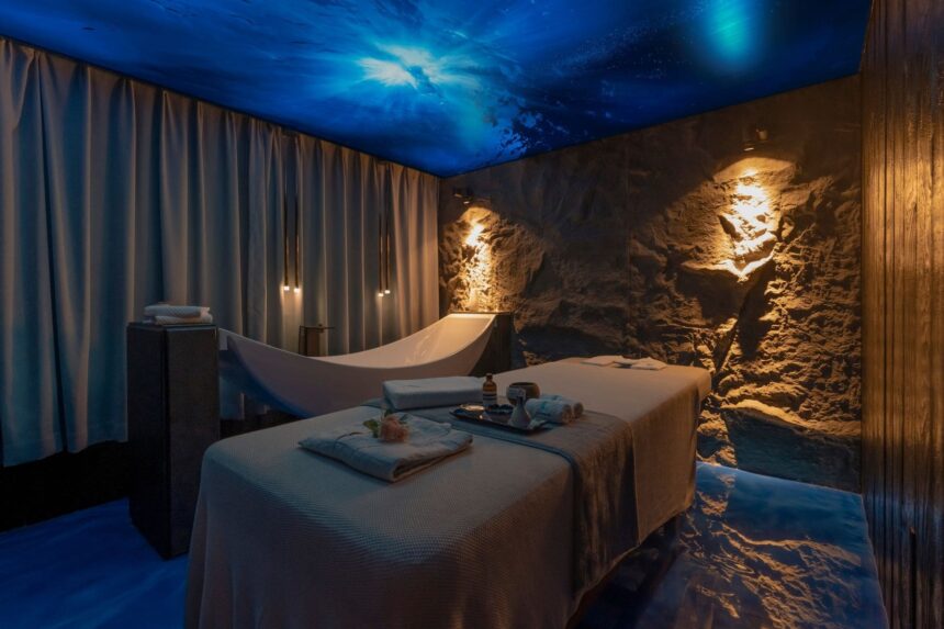 Massage bed and soaking tub in the M/Y White Pearl's spa treatment room