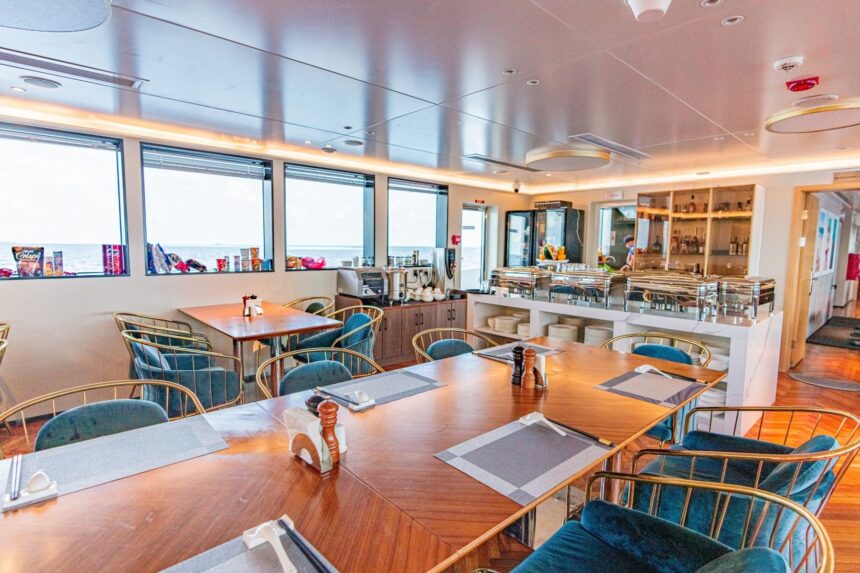 Dining area with ocean-view windows and buffet counter aboard the M/Y White Pearl