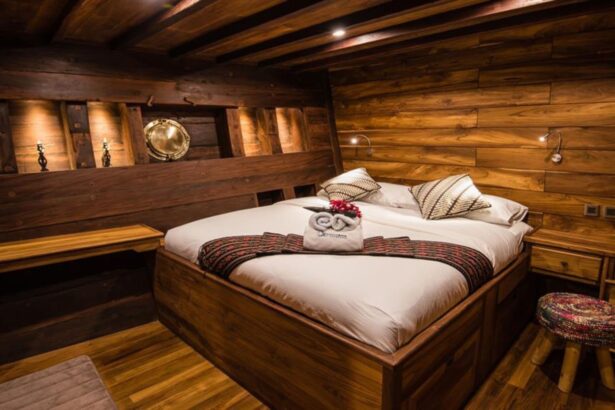 Wood-paneled cabin bed aboard the Samambaia liveaboard