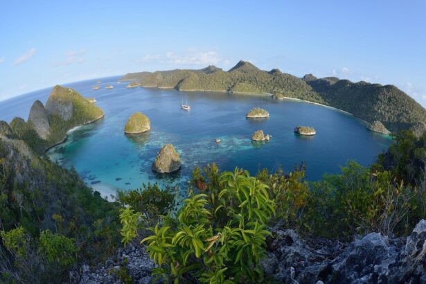 Aerial view of a lagoon surrounded by jungle-covered islands in Raja Ampat