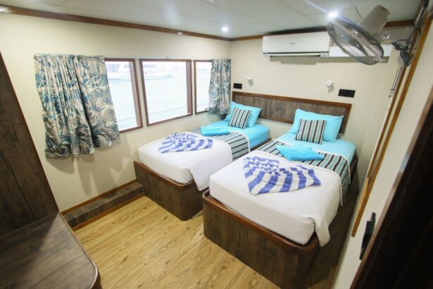 The MV Emperor Voyager liveaboard with crew members on deck