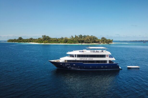 The Emperor Virgo liveaboard anchored near a tropical island