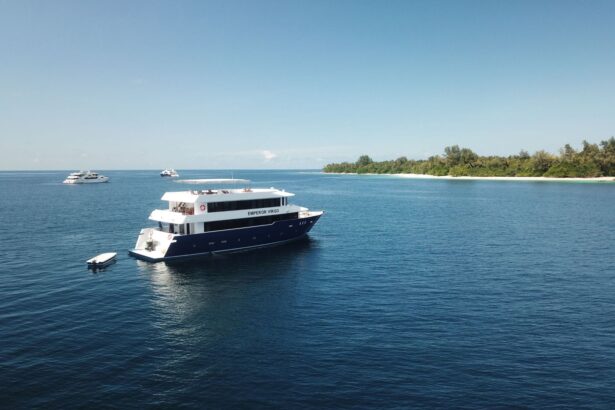 The Emperor Virgo liveaboard anchored near a Maldivian island reef