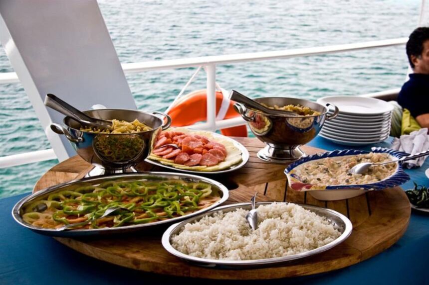 Buffet trays of rice, vegetables and meats set out on deck aboard the Avalon fleet