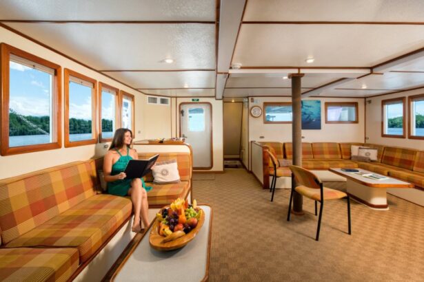 A guest curls up with a book on the Sea Hunter's library couch