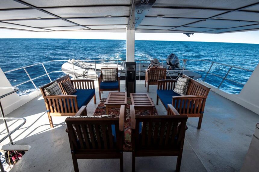 Outdoor deck seating area at the stern of the Rocio del Mar liveaboard