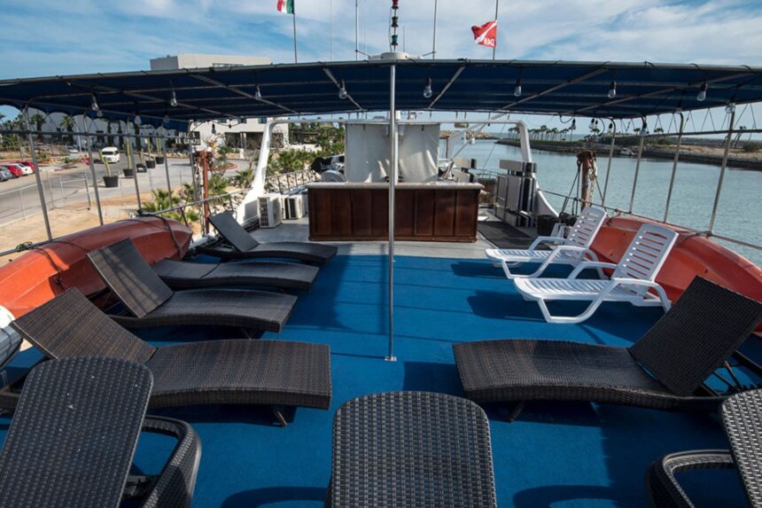 Sun deck loungers and shade canopy on the Rocio del Mar in port