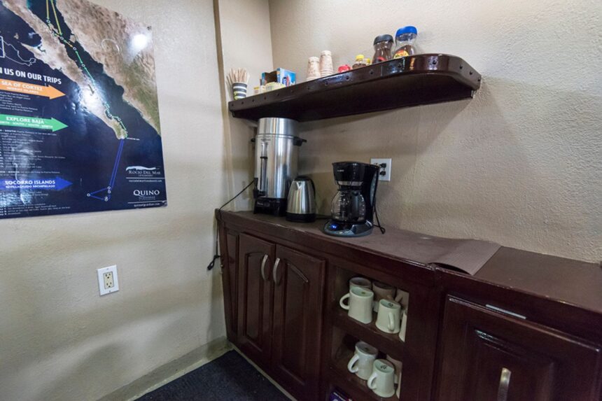 Coffee station with urn and mugs set up on the Rocio del Mar liveaboard