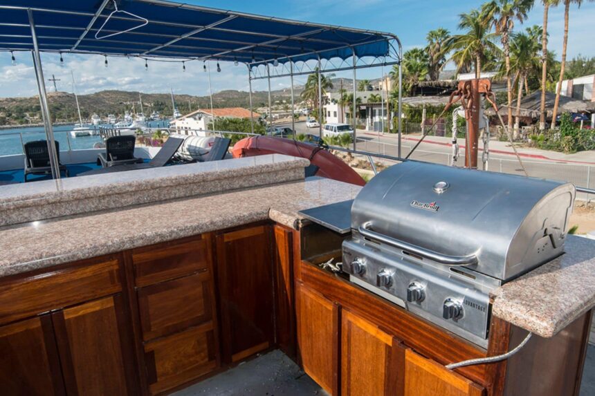Outdoor bar and grill station on the upper deck of the Rocio del Mar in harbor