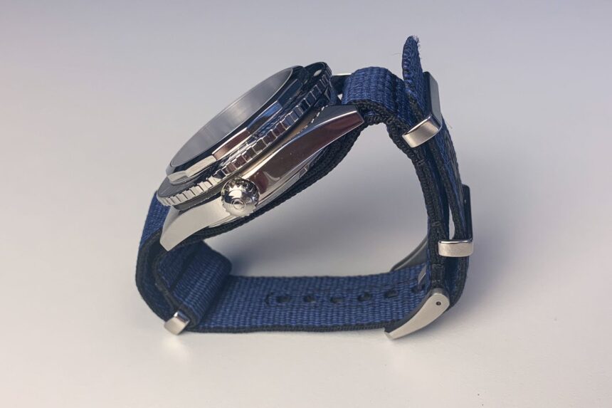 Side view of the Certina DS Super PH500M showing the screw-down crown and blue NATO strap