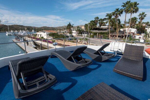 Rows of wicker deck chairs on the Rocio del Mar sun deck overlooking the marina