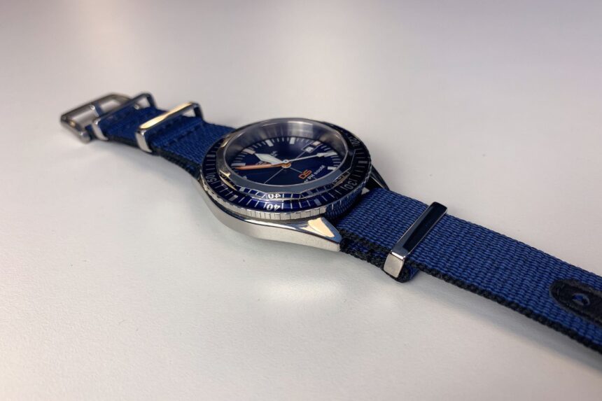 Certina PH500M Polished Case Angled view of the Certina DS Super PH500M with its high-polish steel case and blue bezel